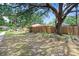 Well-maintained front yard with mature trees and landscaping, enhancing the curb appeal of the home at 107 Halton Cir, Seffner, FL 33584