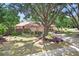 Lovely home with a spacious front yard, mature trees, and beautiful landscaping for a welcoming feel at 107 Halton Cir, Seffner, FL 33584