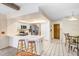 Open kitchen design with a breakfast bar, white cabinetry, and a view to the breakfast area at 107 Halton Cir, Seffner, FL 33584