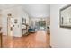 Bright living room with hardwood floors and access to the screened-in pool area at 107 Halton Cir, Seffner, FL 33584