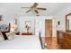 Main bedroom featuring hardwood floors, white walls, and a ceiling fan at 107 Halton Cir, Seffner, FL 33584