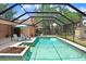 Inviting screened-in pool area with lounge chairs, perfect for relaxing and enjoying the Florida sunshine at 107 Halton Cir, Seffner, FL 33584