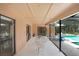 Covered lanai with view of pool, dining table and comfortable lounge seating at 107 Halton Cir, Seffner, FL 33584