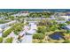 Community aerial showing the beautiful landscaping, mature trees, and nearby lake access at 11224 82Nd Ave # 104, Seminole, FL 33772