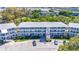 Exterior view of a well-maintained building with neatly landscaped grounds and convenient parking at 11224 82Nd Ave # 104, Seminole, FL 33772