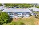 Exterior elevation shows large screened in lanais on a well maintained building and grounds at 11224 82Nd Ave # 104, Seminole, FL 33772