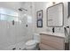 Modern bathroom boasts a glass-enclosed shower, sleek vanity, and contemporary fixtures at 11723 Gothic Ln, Tampa, FL 33626