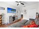 Bright bedroom with hardwood floors, ceiling fan, and television at 11723 Gothic Ln, Tampa, FL 33626