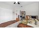 Comfortable bedroom with hardwood floors, closet, and adjacent sitting room at 11723 Gothic Ln, Tampa, FL 33626