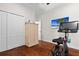 Bright exercise room features modern fitness equipment, ample storage, and hardwood floors at 11723 Gothic Ln, Tampa, FL 33626