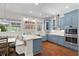 Charming kitchen features custom cabinetry, marble counters, and a cozy eat-in area at 11723 Gothic Ln, Tampa, FL 33626