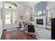 Bright living room features soaring ceilings, lots of natural light, fireplace, and elegant decor at 11723 Gothic Ln, Tampa, FL 33626