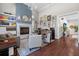 Beautiful living room with hardwood floors, fireplace, built-in shelving, and stylish decor at 11723 Gothic Ln, Tampa, FL 33626