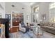 Spacious living room with hardwood floors, stylish decor, and large windows for natural light at 11723 Gothic Ln, Tampa, FL 33626