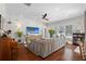 Bright and airy living room features hardwood floors, ceiling fan, and lots of natural light at 11723 Gothic Ln, Tampa, FL 33626