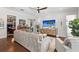 Inviting living room featuring a media center, hardwood floors, and an open layout at 11723 Gothic Ln, Tampa, FL 33626