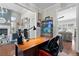 Comfortable home office with a large desk, decorative walls, and an aquarium for a relaxing atmosphere at 11723 Gothic Ln, Tampa, FL 33626