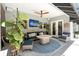 Inviting screened-in patio featuring a ceiling fan, seating, and access to outdoor amenities at 11723 Gothic Ln, Tampa, FL 33626