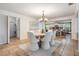 Dining room with view to kitchen and laundry room at 118 S Manhattan Ave, Tampa, FL 33609