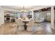 Cozy dining room with stone floors, view to kitchen and living room at 118 S Manhattan Ave, Tampa, FL 33609