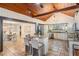 Open-concept kitchen with bar seating and access to dining room at 118 S Manhattan Ave, Tampa, FL 33609