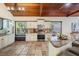 Bright kitchen with stainless appliances, granite counters, and tile floor at 118 S Manhattan Ave, Tampa, FL 33609