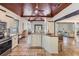 Open floor plan kitchen with bar seating looking into the living area at 118 S Manhattan Ave, Tampa, FL 33609