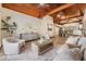 Stylish living room with vaulted wood ceilings, tile floors, and modern decor at 118 S Manhattan Ave, Tampa, FL 33609