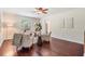 Office with wood floors, ceiling fan, and neutral walls bathed in natural light at 118 S Manhattan Ave, Tampa, FL 33609