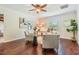 Office with wood floors, ceiling fan, and neutral walls bathed in natural light at 118 S Manhattan Ave, Tampa, FL 33609
