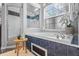 Bathroom showcasing the walk-in shower, a soaking tub with chrome fixtures, and a large window at 12009 Wandsworth Dr, Tampa, FL 33626