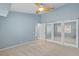Bright bedroom features a ceiling fan, light-colored carpet, and mirrored closet doors at 12009 Wandsworth Dr, Tampa, FL 33626