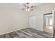 Spacious bedroom features a ceiling fan, large closet and stylish laminate floors at 12009 Wandsworth Dr, Tampa, FL 33626