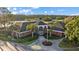 Attractive brick clubhouse with a central tower, palm trees and circle driveway at 12009 Wandsworth Dr, Tampa, FL 33626