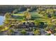 Aerial view of the Radcliffe community clubhouse, surrounded by parking, trees, and the golf course at 12009 Wandsworth Dr, Tampa, FL 33626