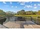 Relaxing lake view from dock with bench seating, perfect spot to enjoy nature's beauty at 12009 Wandsworth Dr, Tampa, FL 33626