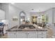 Open kitchen featuring a gas cooktop on the island and view of the dining area at 12009 Wandsworth Dr, Tampa, FL 33626