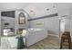 Bright living room with fireplace, vaulted ceiling, and tile flooring at 12009 Wandsworth Dr, Tampa, FL 33626