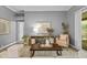 Cozy living room with comfortable furniture, neutral tones, and a view to the patio at 12009 Wandsworth Dr, Tampa, FL 33626