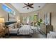 The main bedroom features neutral paint, wood-look floors, and sliding glass doors to the outside at 12009 Wandsworth Dr, Tampa, FL 33626