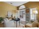 Cozy home office with a desk, chair, and natural light filtering through the blinds at 12009 Wandsworth Dr, Tampa, FL 33626