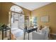 Bright home office with a desk, seating, and a view of the foyer with the entrance door at 12009 Wandsworth Dr, Tampa, FL 33626
