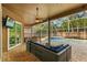 Relaxing screened patio with ceiling fan, outdoor furniture, and poolside TV at 12009 Wandsworth Dr, Tampa, FL 33626
