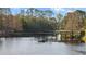 Wood bridge over a calm pond surrounded by trees and walking paths at 12009 Wandsworth Dr, Tampa, FL 33626