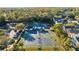 Aerial view of a community tennis complex with multiple courts and shade structures at 12009 Wandsworth Dr, Tampa, FL 33626