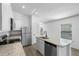 Modern kitchen boasting granite countertops, stainless steel appliances, and an island sink at 12074 Manassas Ave, Weeki Wachee, FL 34614