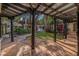 Beautiful backyard featuring a covered patio, lush landscaping, and charming architectural details at 122 Miramar Ne Blvd, St Petersburg, FL 33704