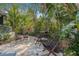 Cozy backyard patio with comfortable seating and stone flooring at 122 Miramar Ne Blvd, St Petersburg, FL 33704