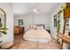 Comfortable bedroom features natural light, decorative flooring, and a serene atmosphere, perfect for relaxation at 122 Miramar Ne Blvd, St Petersburg, FL 33704