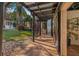 Covered walkway featuring beautiful tile flooring and views of the lush backyard at 122 Miramar Ne Blvd, St Petersburg, FL 33704